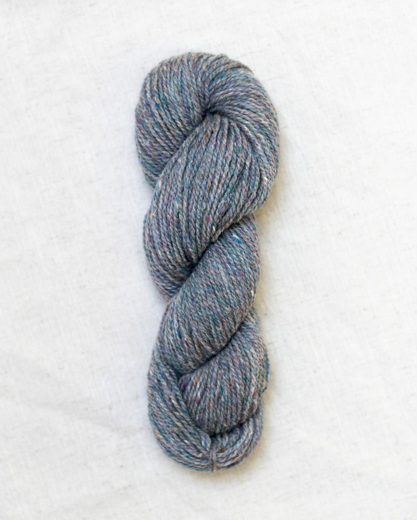 Blue skein of yarn on a white background